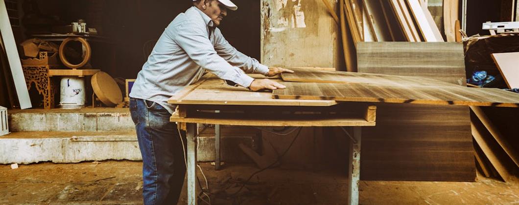 Carpenter working on a high bench.