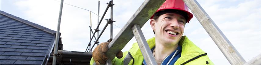 construction worker carrying ladder