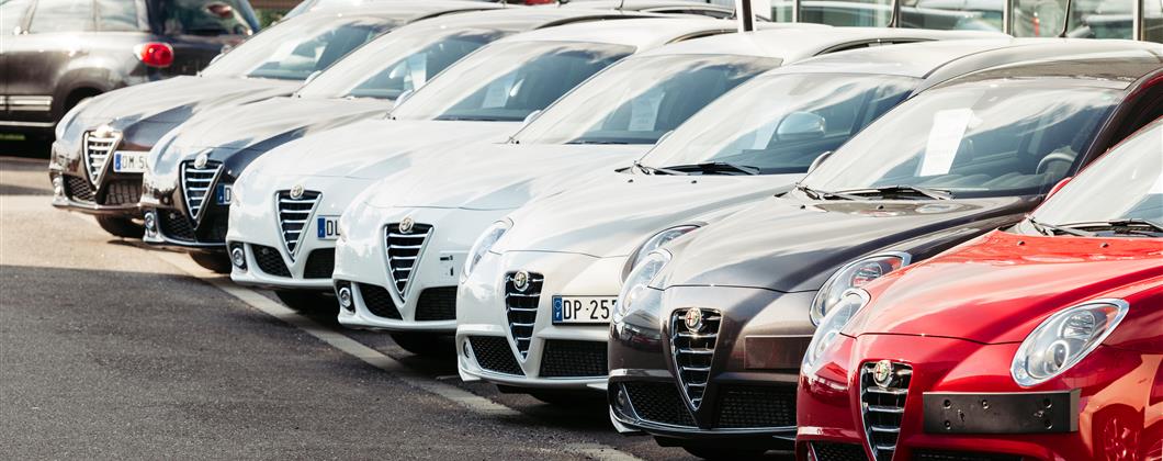 row of cars parked motor trade