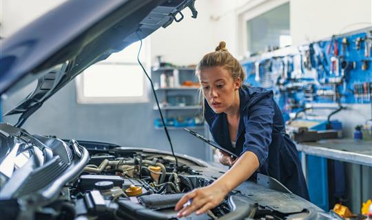 commercial claims woman fixing car