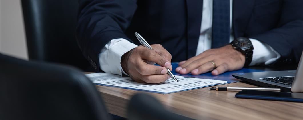 Businessman Signing Paperwork