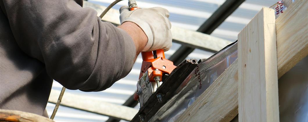 Man working on a property roof.