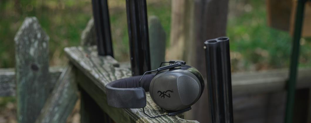 Clay pigeon shooting range gun stands and ear protectors